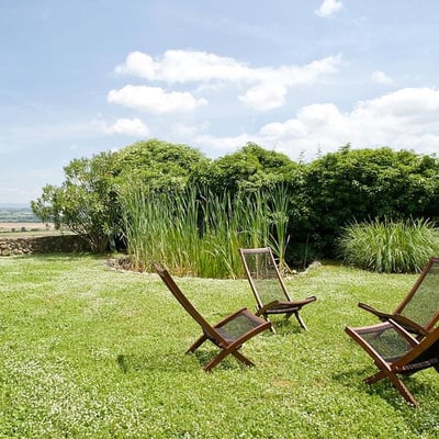 Damiano | A stone cottage with large shaded patio and expansive views