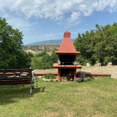 The barbecue has a wonderful view of the "balze" rock formations
