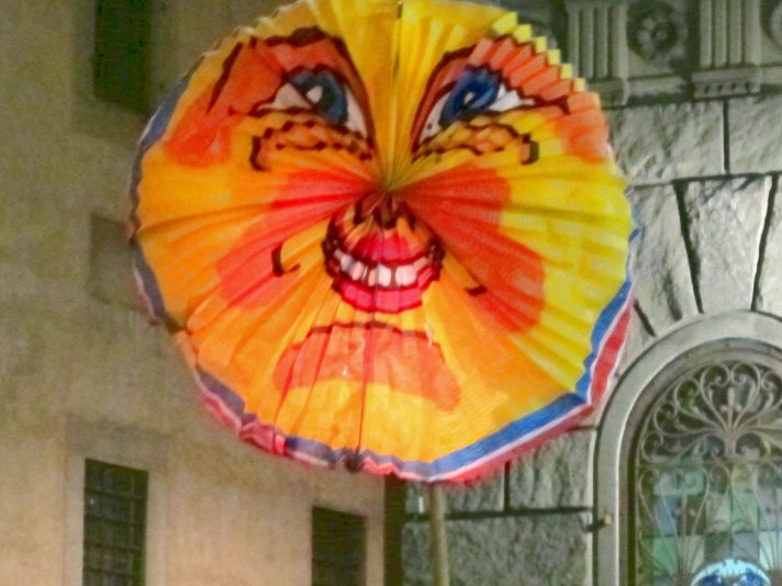 A celebration of the birth of the Virgin Mary with large colourful paper lanterns in Piazza Santissima Annunziata. florence-rificolona