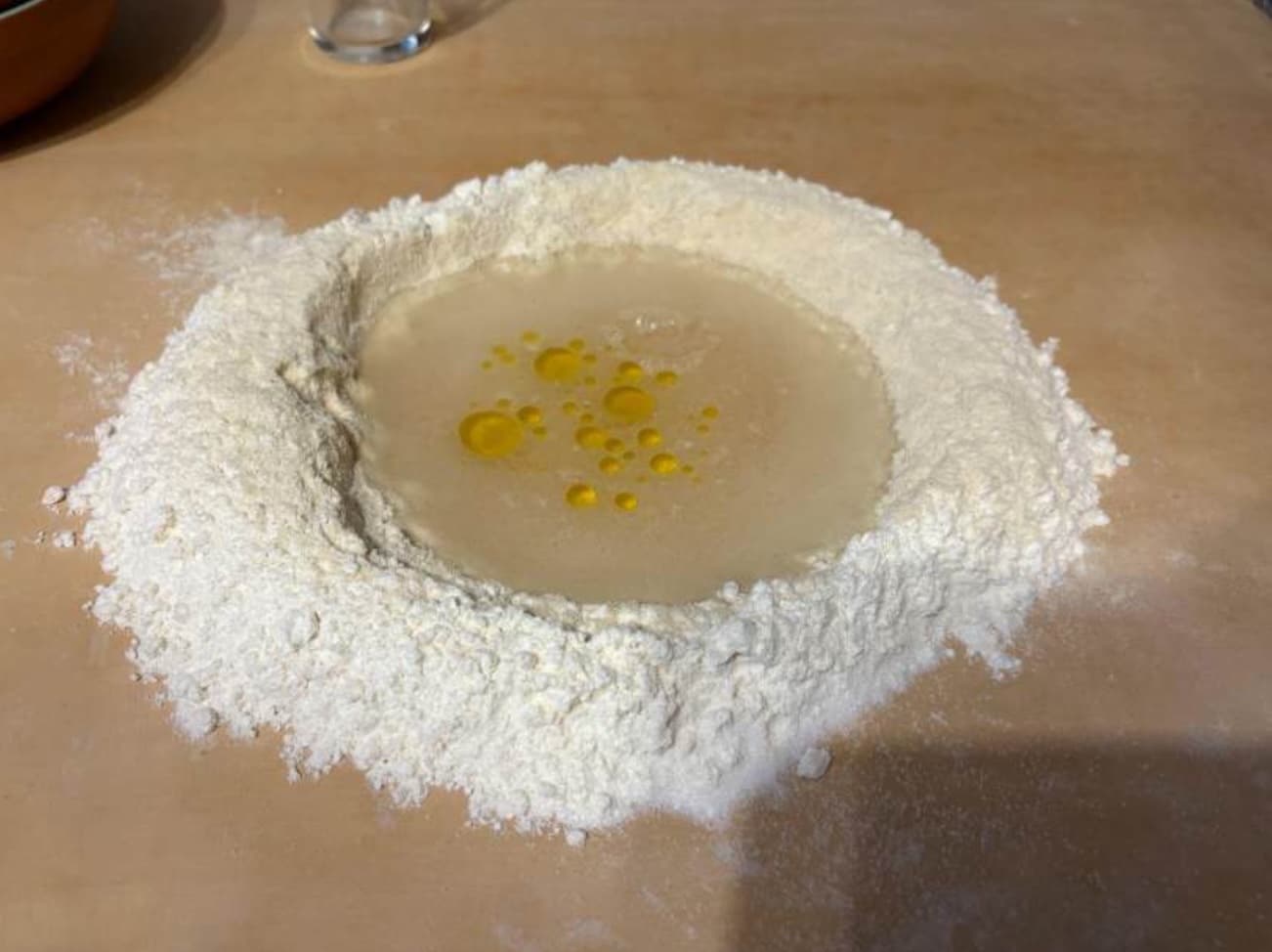 Carefully scrape the flour into the well recipe-for-pici-03