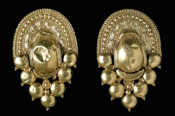 Gold earrings speak to the affluence of the populace